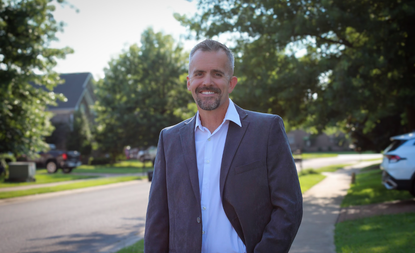 Chris Gonzales standing on a neighborhood street in Ward 4